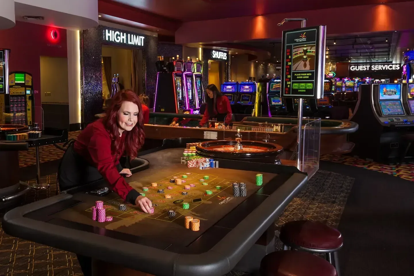 The gaming floor of the Century Casino & Hotel Edmonton, with a live dealer at a roulette table